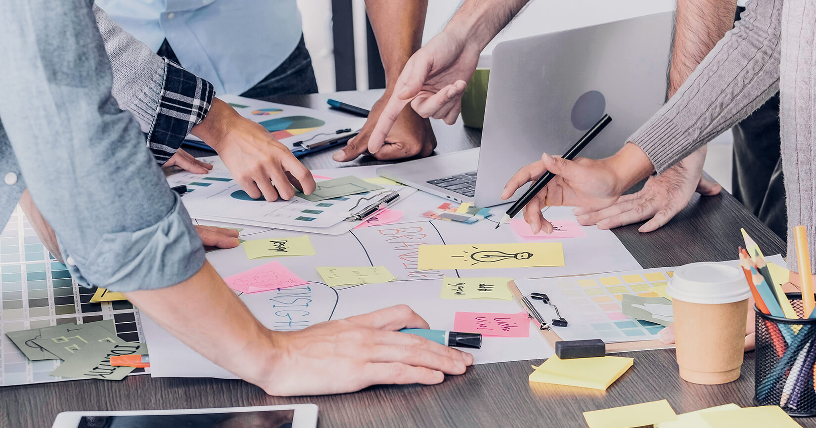 People collaborating on marketing at a table